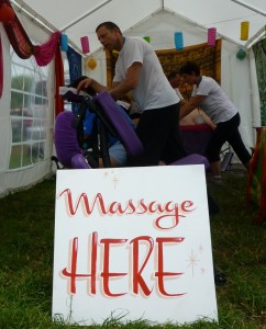 The On the Spot team massaging back stage at Glastonbury 2013